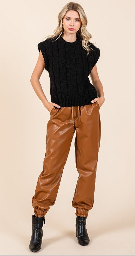 The Cable and Chic black cable-knit sweater vest, front view